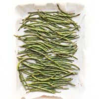 roasted green beans in a rimmed baking sheet