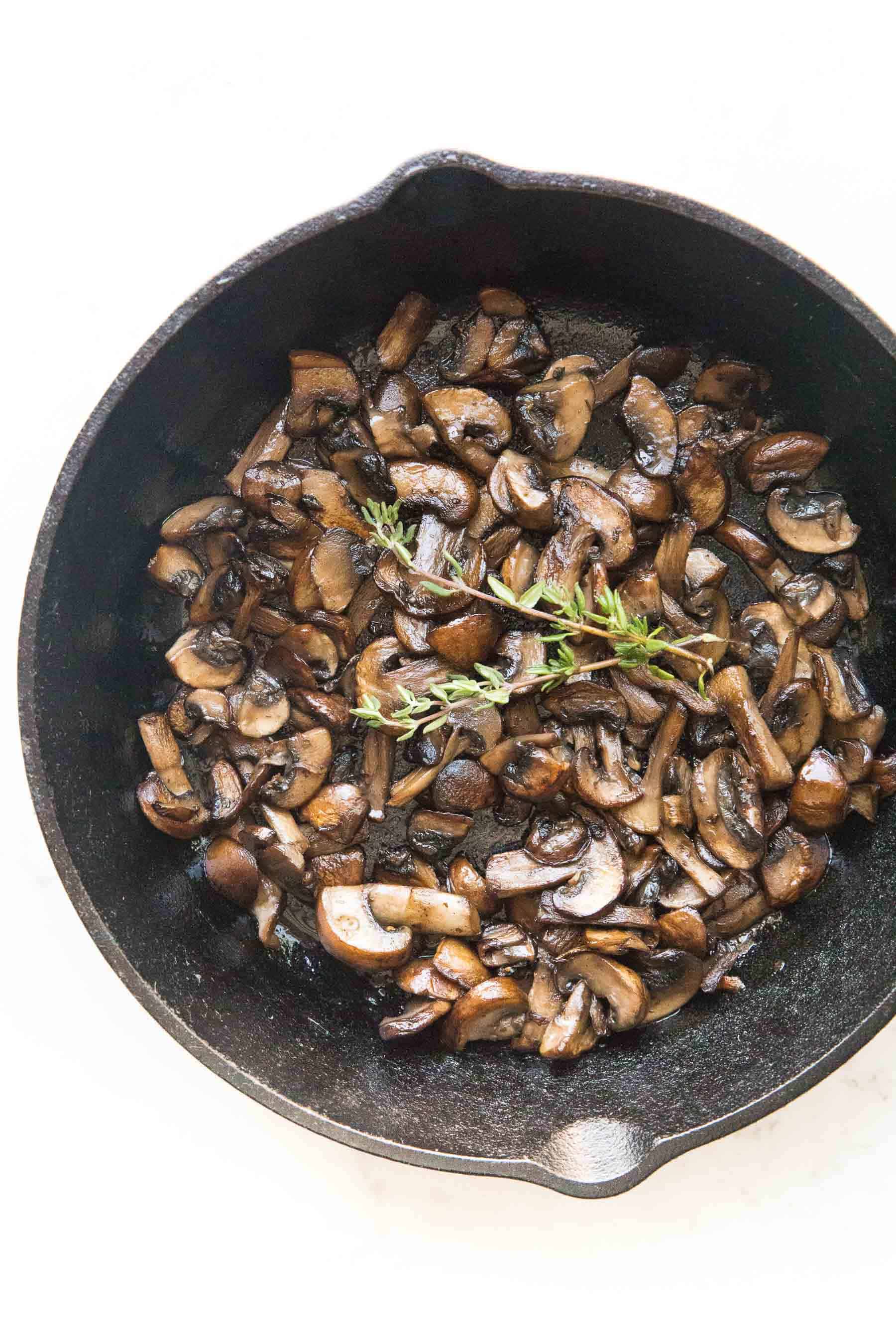 sauteed mushrooms in a cast iron skillet