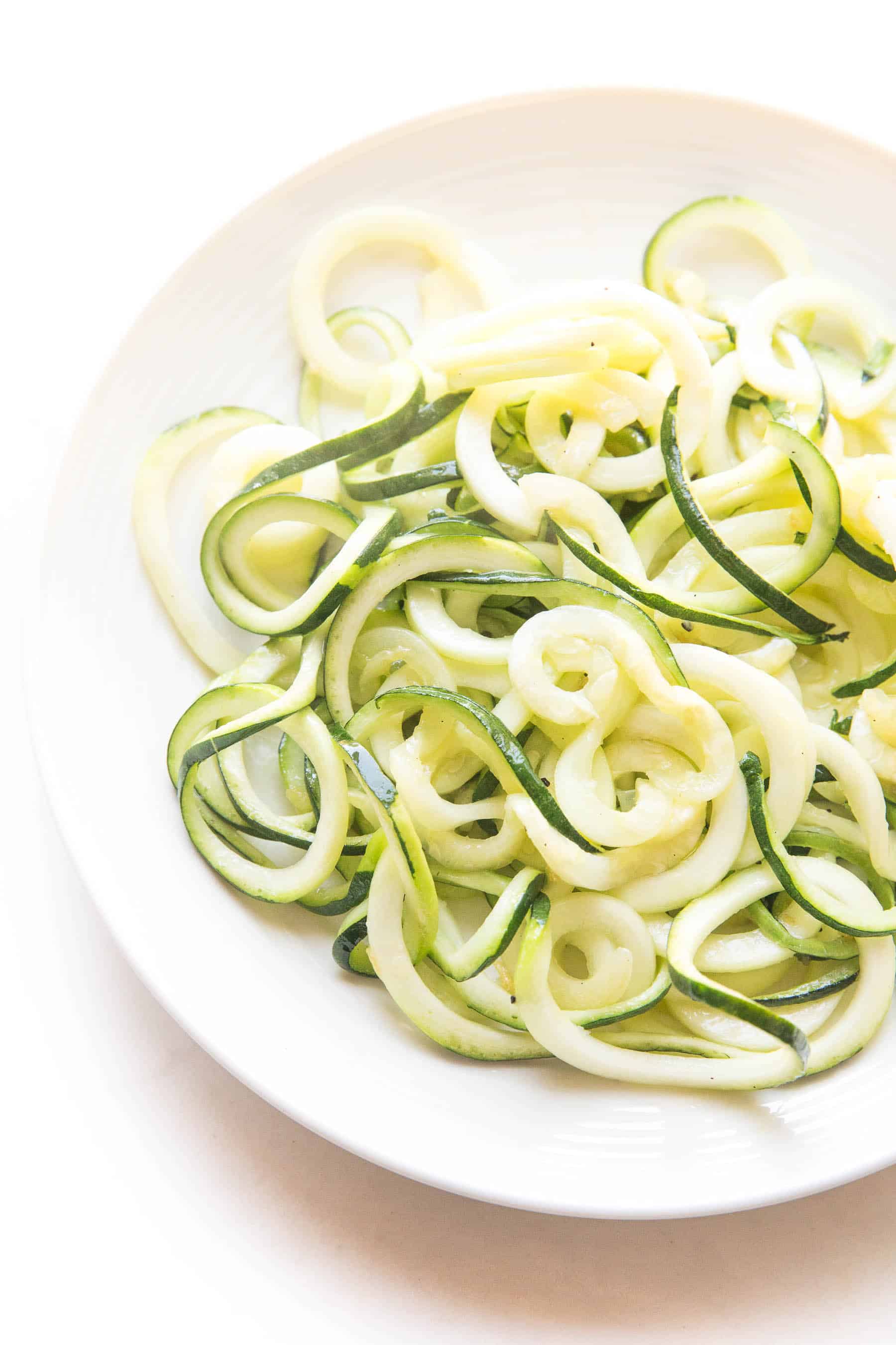 zucchini noodles on a white plate