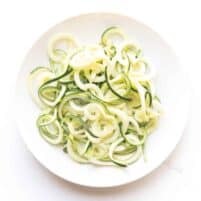 zucchini noodles on a white plate