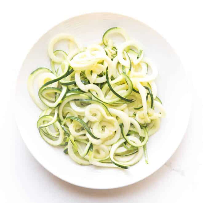 zucchini noodles on a white plate