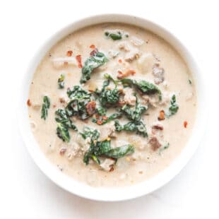 whole30 + keto zuppa toscana soup in a white bowl on a white background