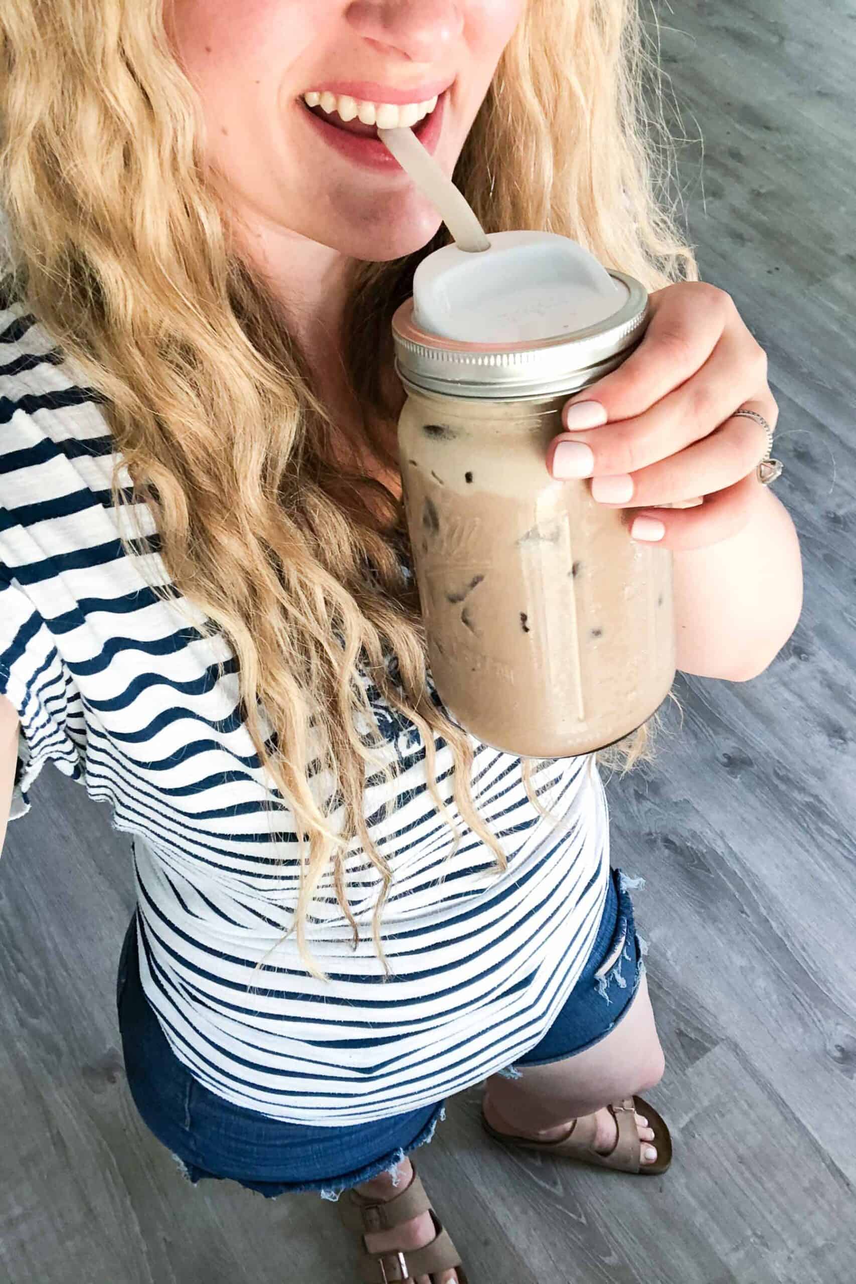 girl holding an iced mocha