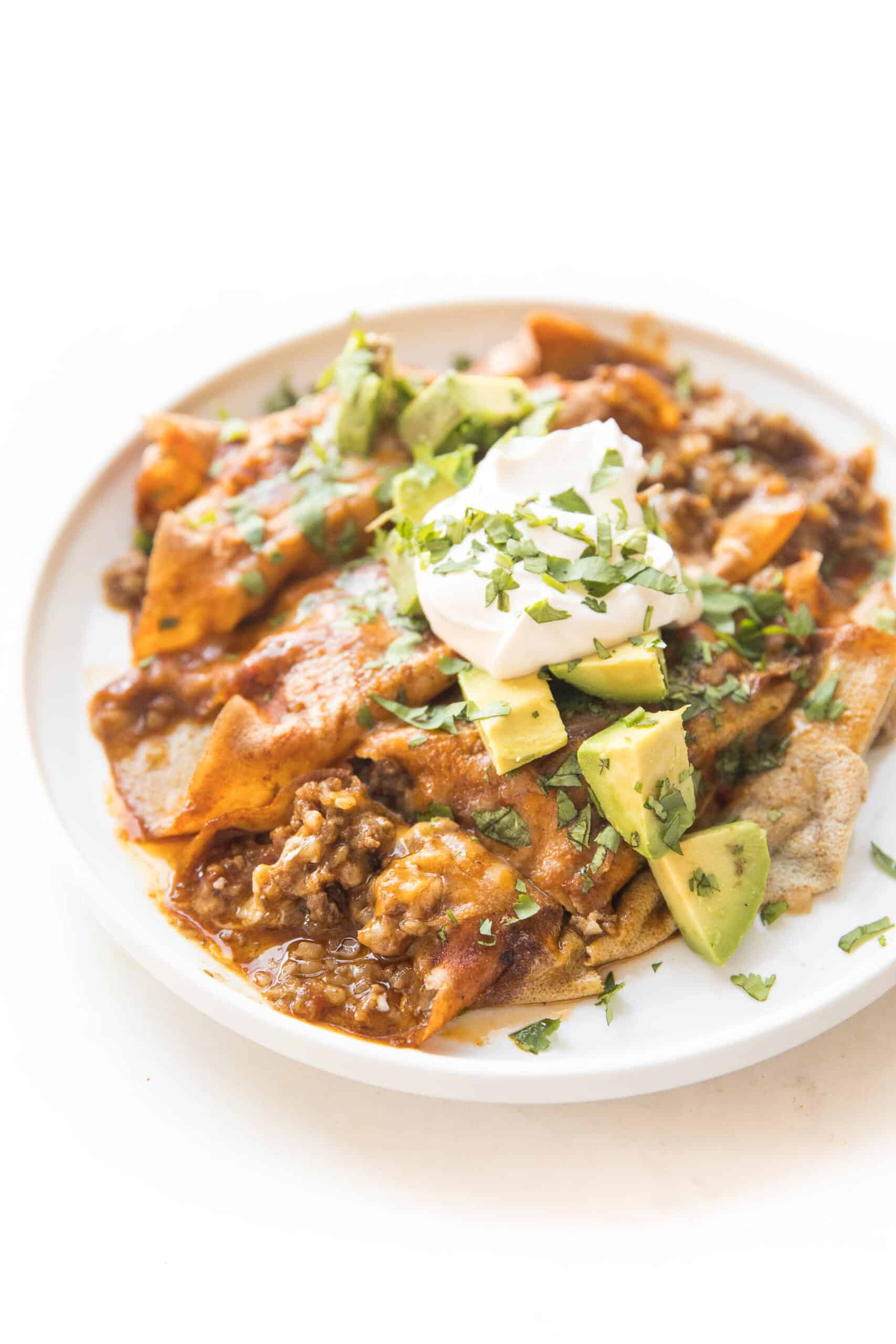 keto beef enchiladas on a white plate