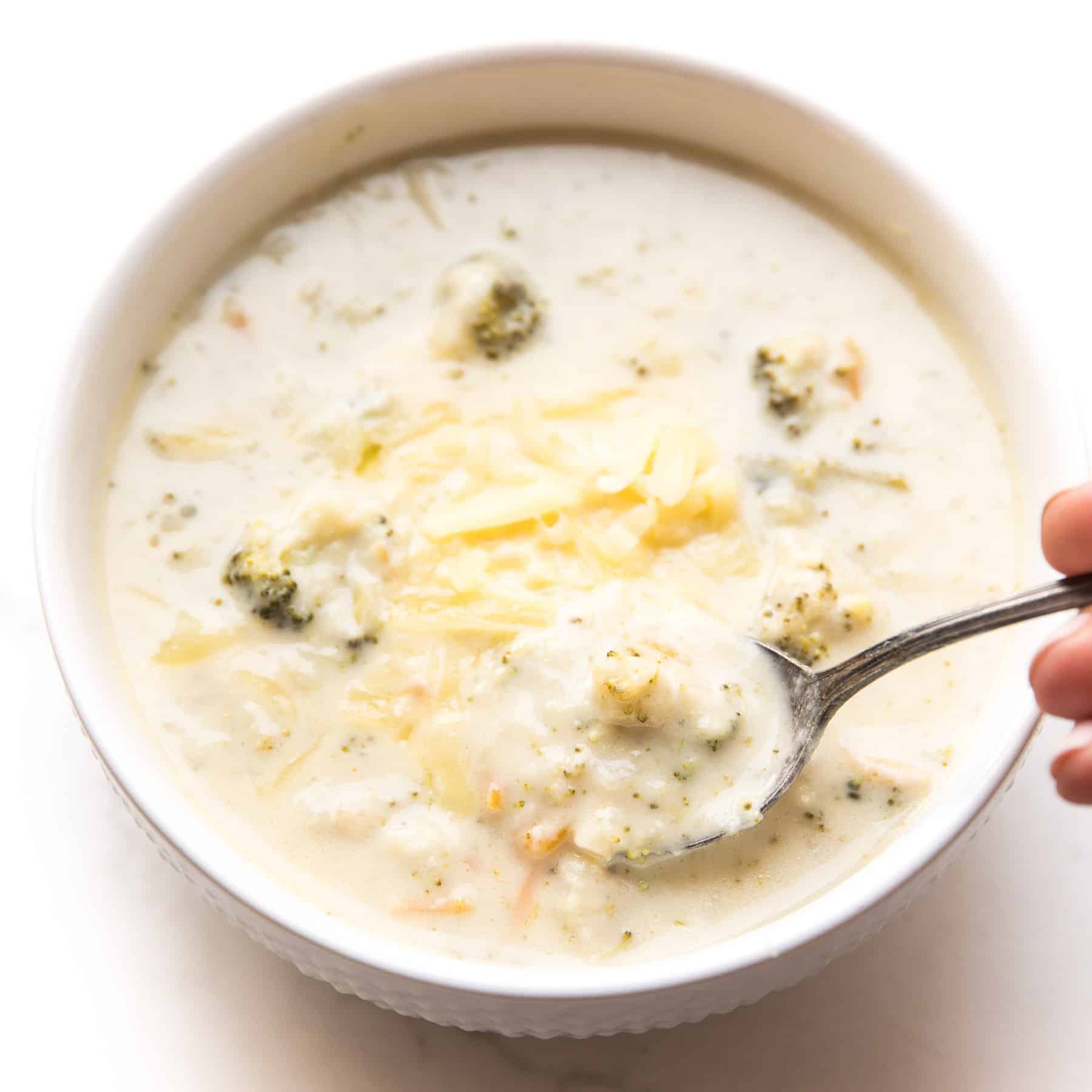 instant pot keto broccoli cheddar soup in a white bowl