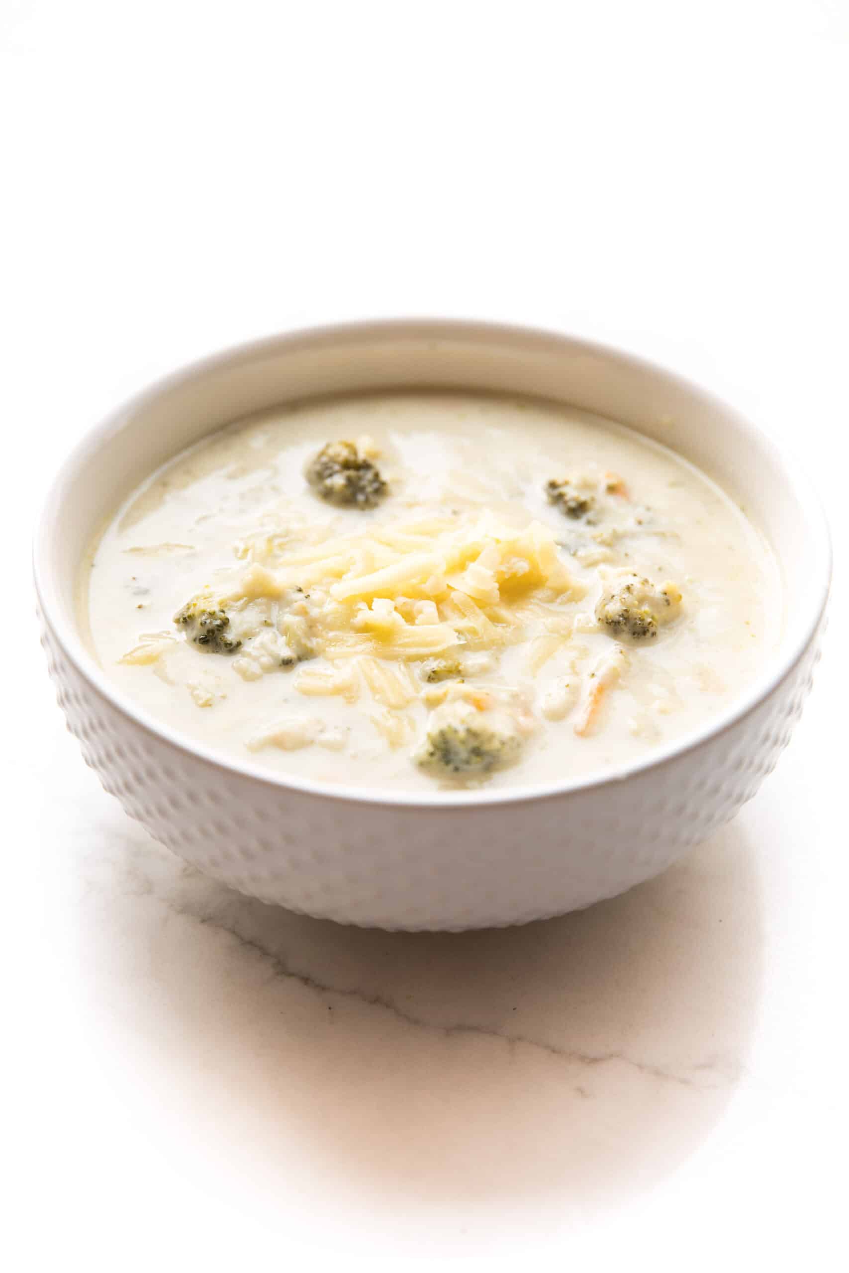 instant pot broccoli cheddar soup in a white bowl