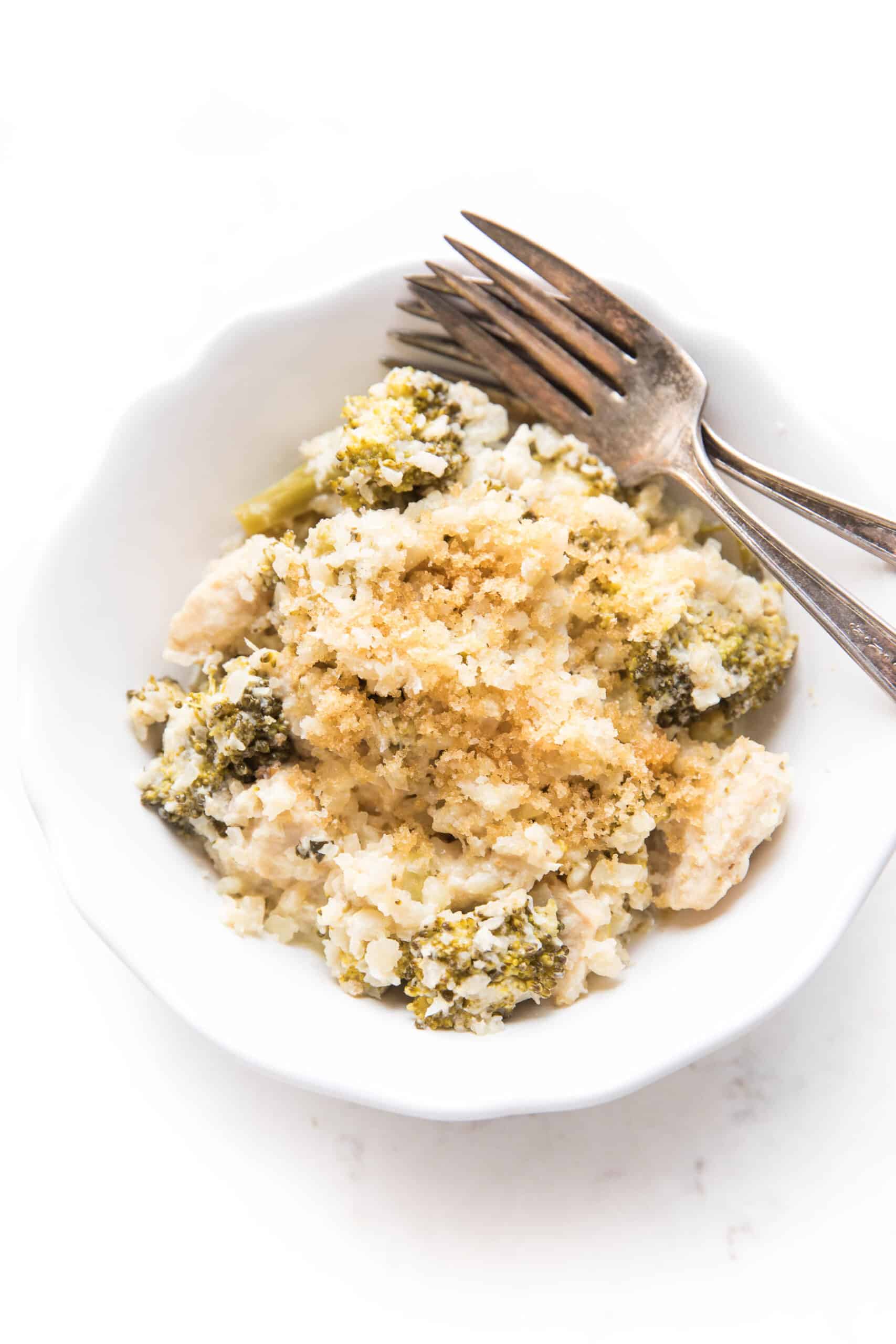 KETO broccoli chicken cauliflower rice casserole in a white bowl