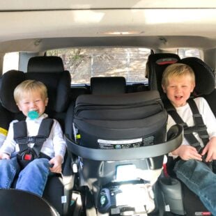 3 car seats across in a row in a 2018 toyota 4runner with 2 toddler boys buckled in