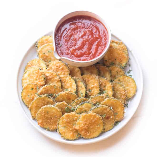 Crispy parmesan zucchini bites appetizer with marinara sauce