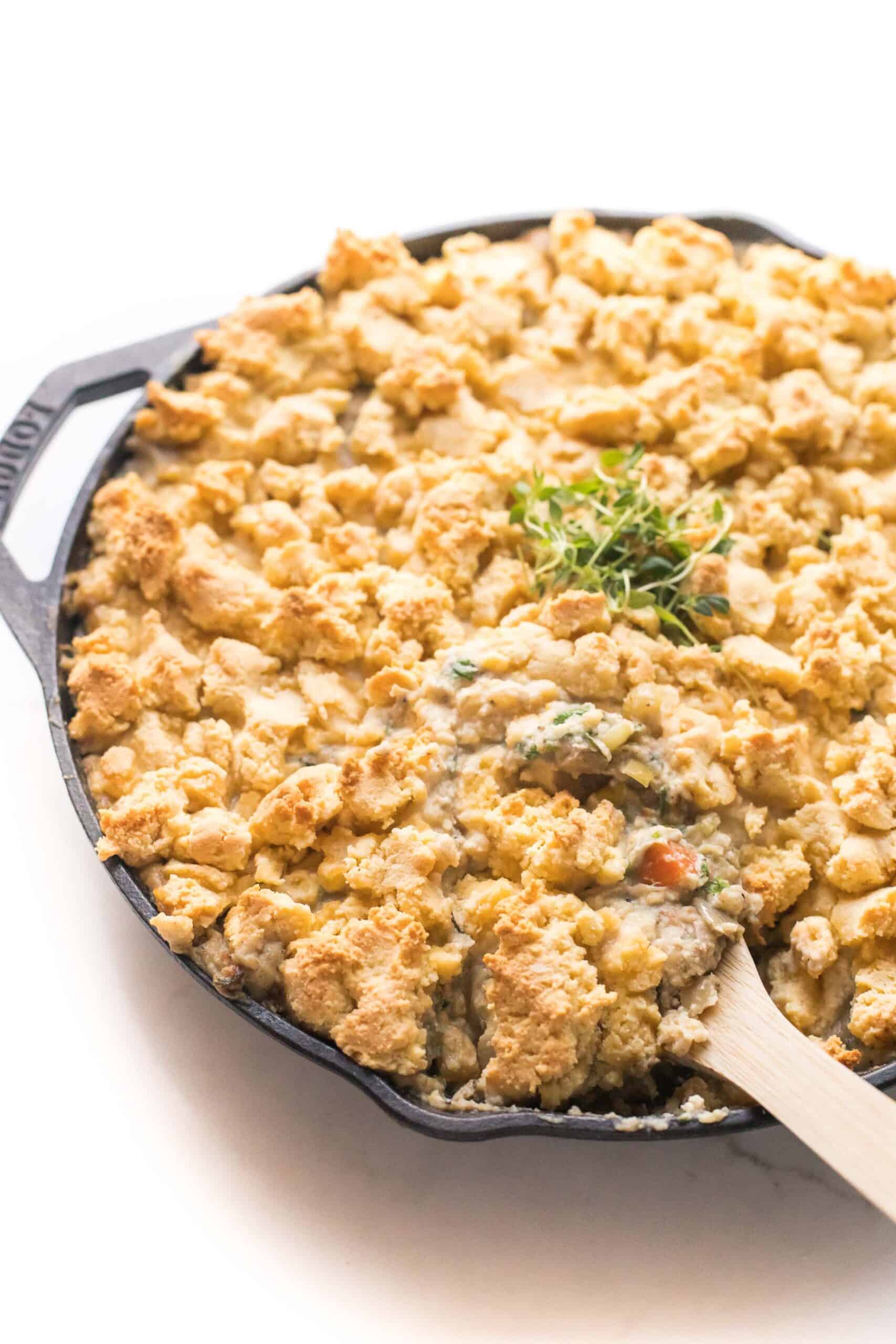 keto chicken pot pie crumble in a cast iron skillet on a white background