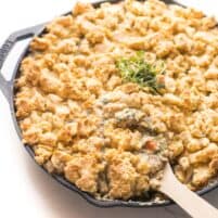 keto chicken pot pie crumble in a cast iron skillet on a white background