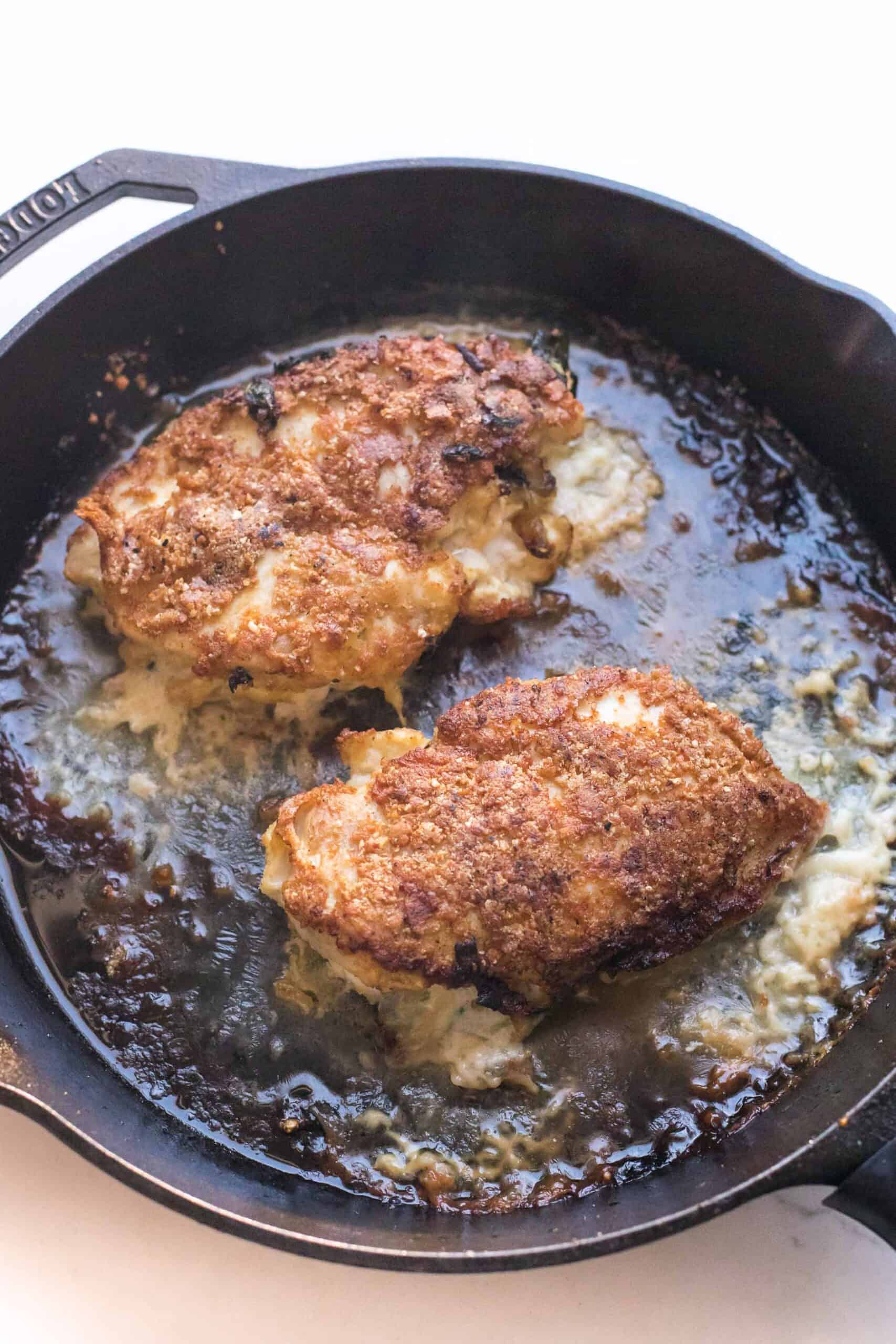 crispy breaded chicken in a cast iron skillet