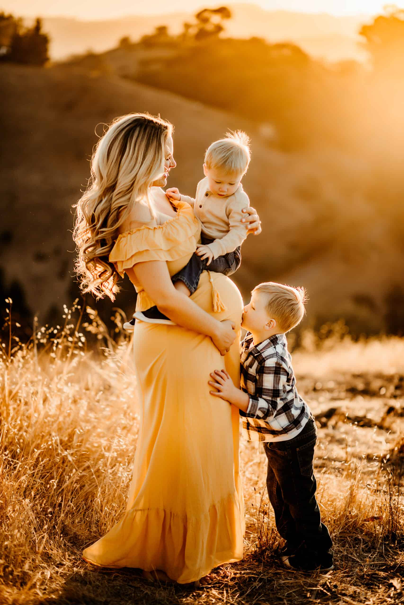 pregnant women in yellow dress with 2 little boys, boy mom of 3, sunset photo