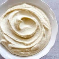 dairy free ricotta in a white bowl with a white background