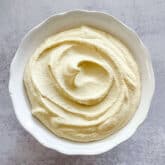 dairy free ricotta in a white bowl with a white background