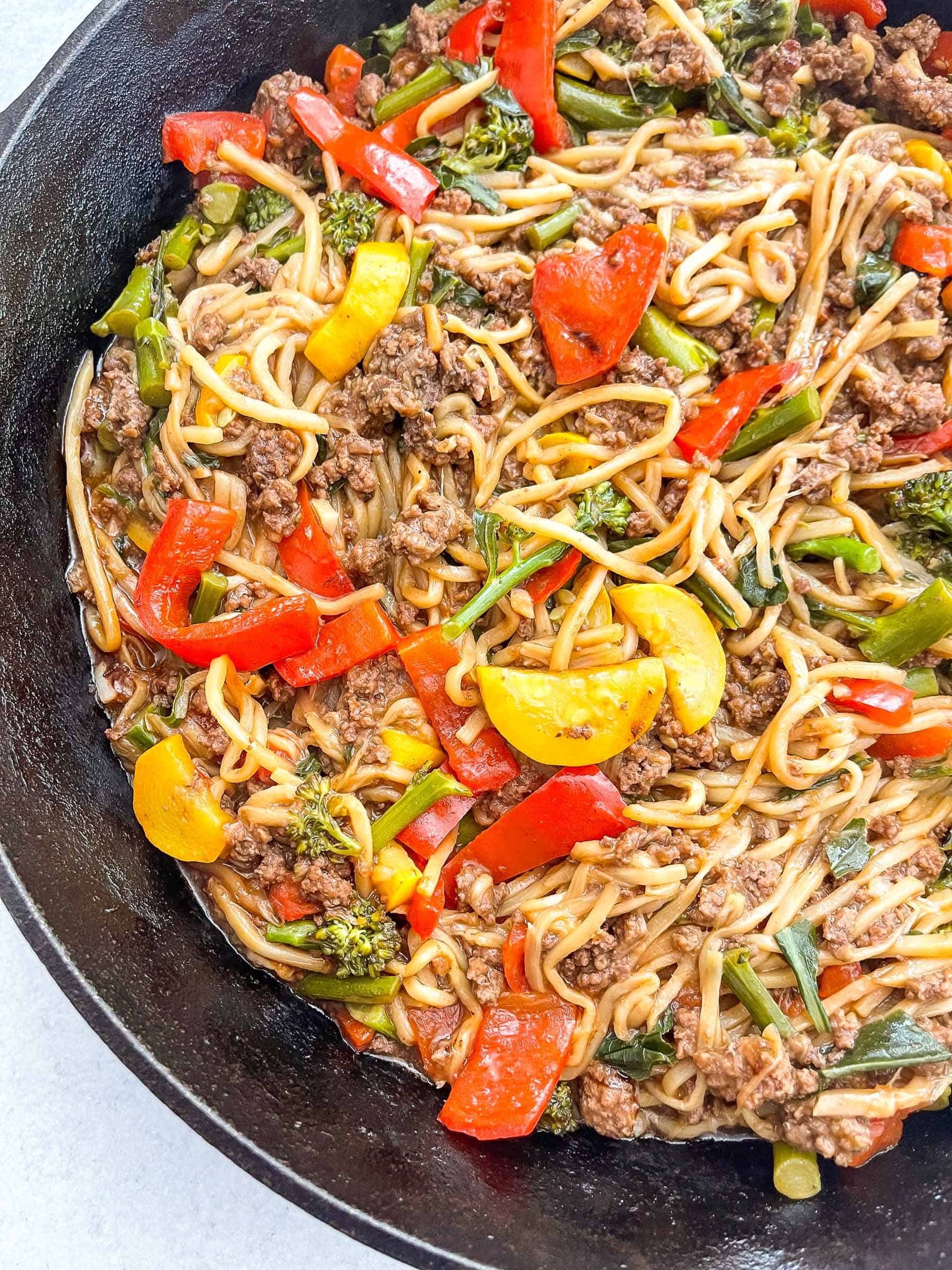 keto beef and vegetable noodle stir fry in a cast iron skillet