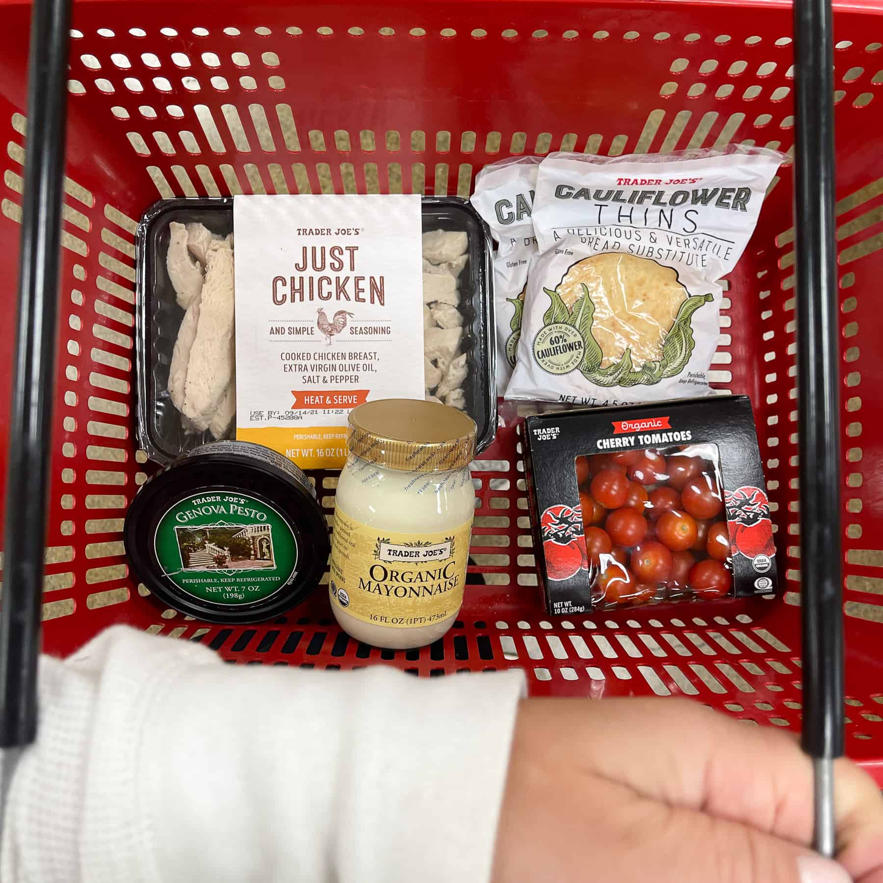 ingredients for keto pesto chicken salad in a red trader joe's basket