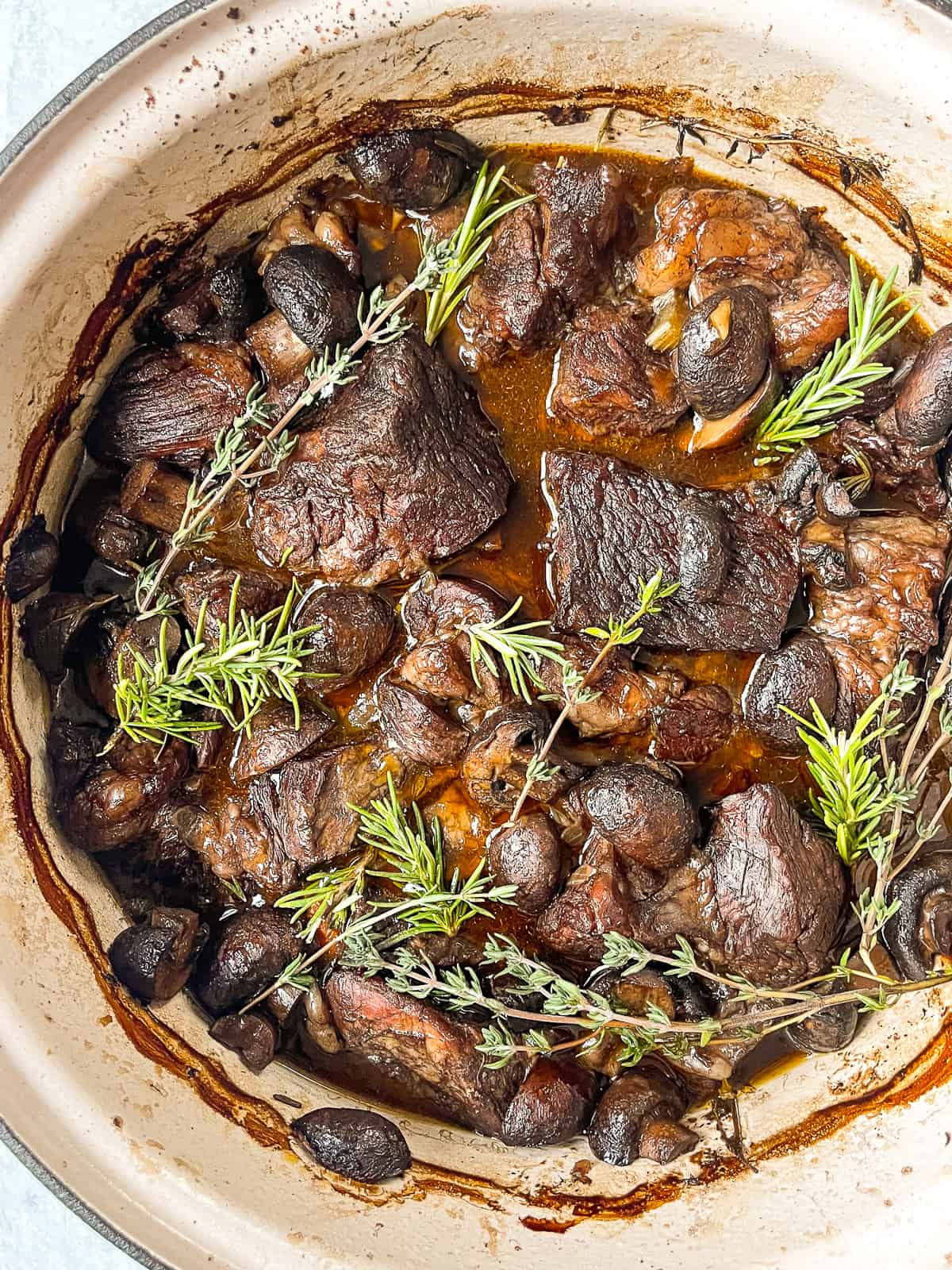 close up of braised beef with mushrooms recipe in a dutch oven