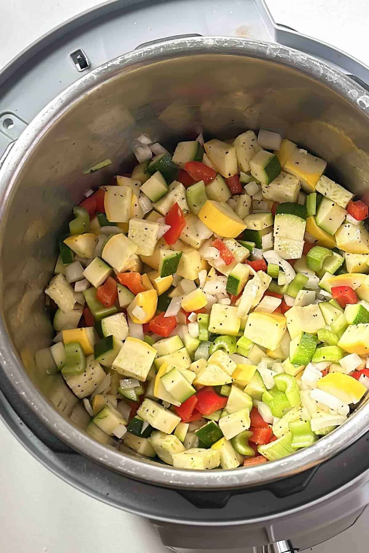 Sautéed vegetables in an Instant Pot during chili prep