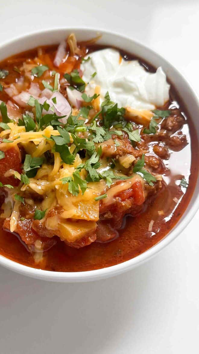 a bowl of whole30 and keto chili with toppings
