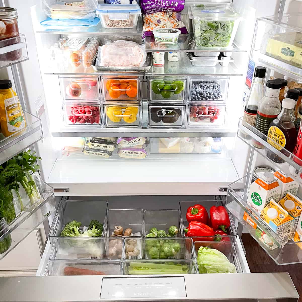 https://www.tasteslovely.com/wp-content/uploads/2022/01/refrigerator-organization-containers.jpg