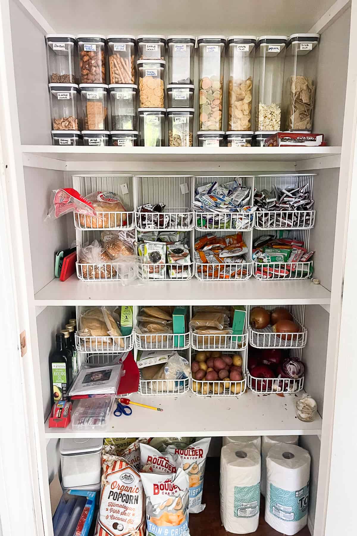 containers and storage baskets in an organized pantry