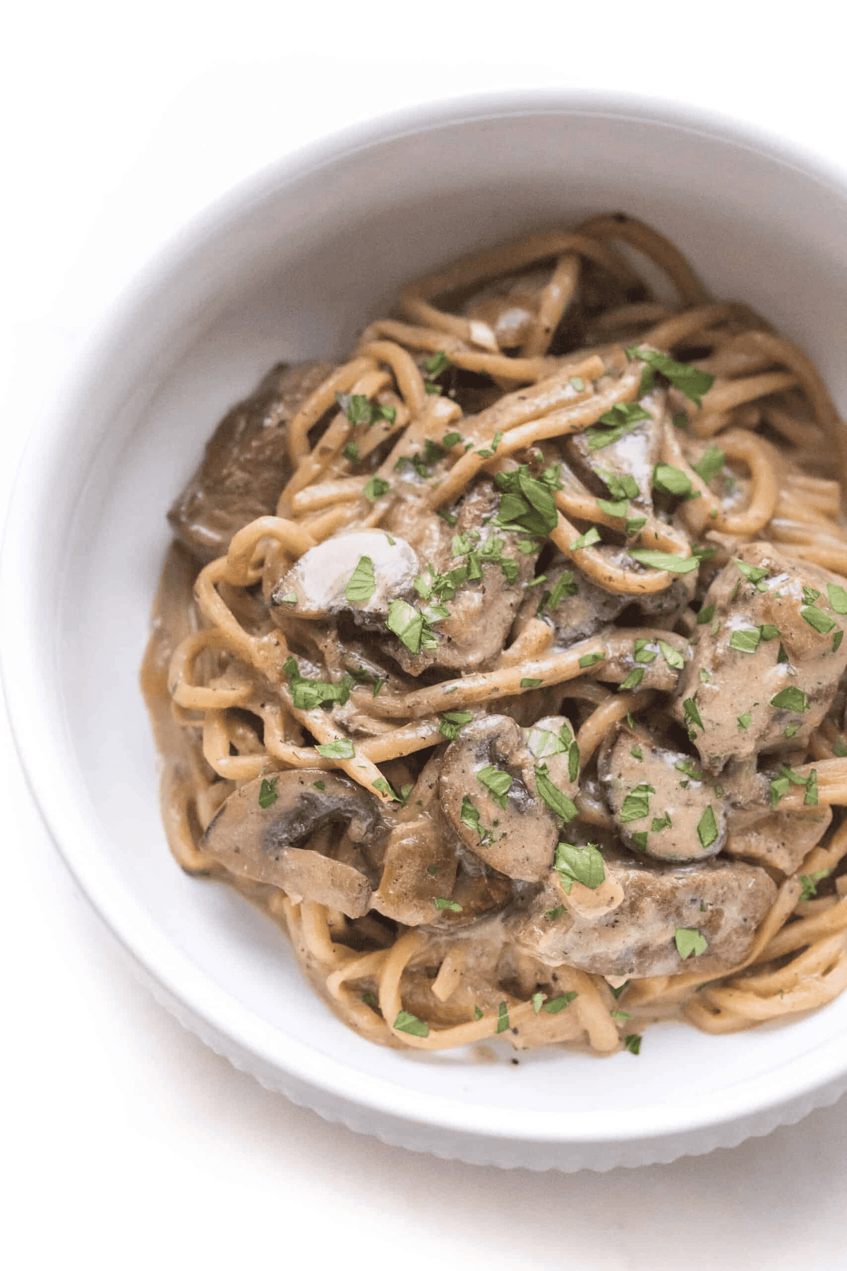 Photo of beef stroganoff served in a white bowl