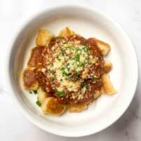 Instant pot beef ragu in a white bowl