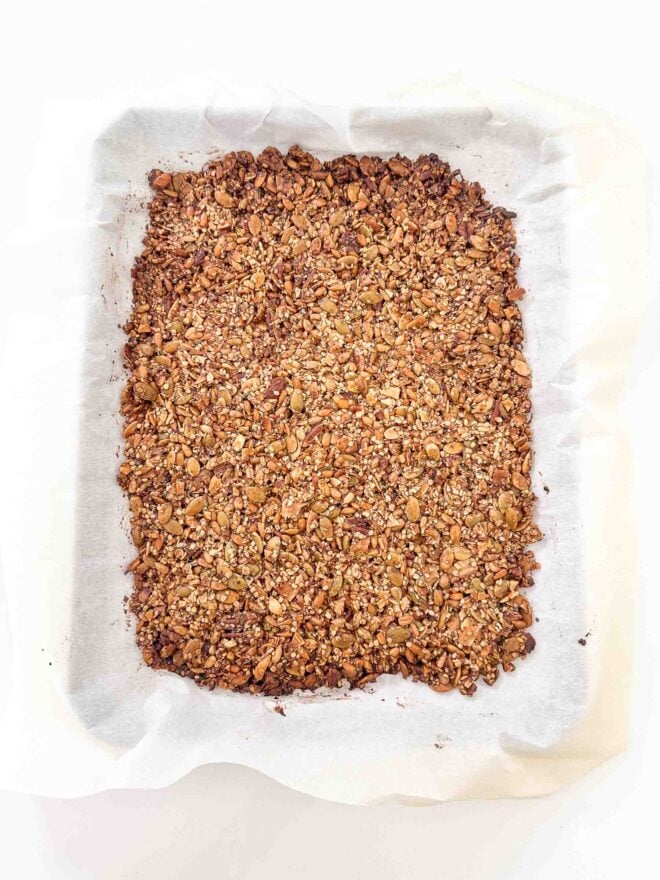 baked granola on a baking sheet 