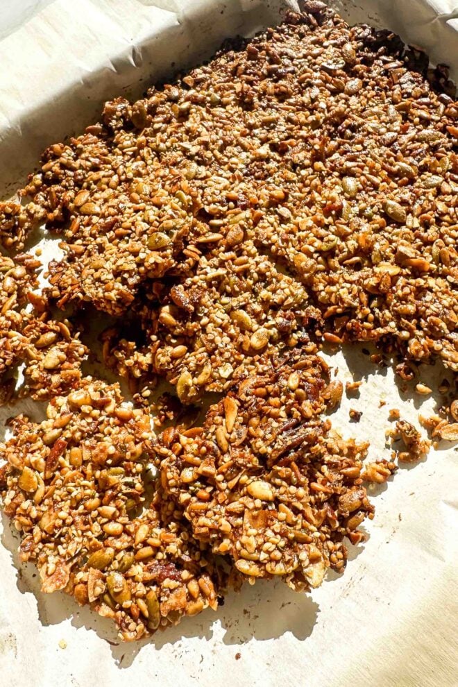 grain free granola broken up on a baking sheet 