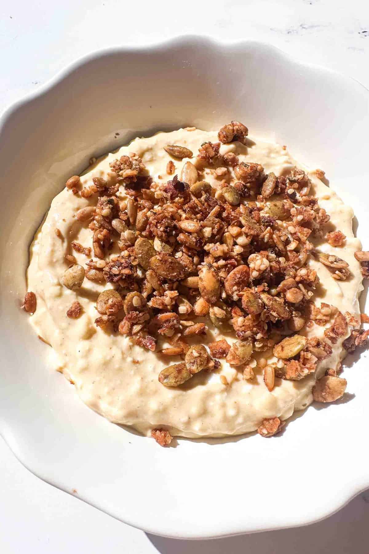 cottage cheese cheesecake filling topped with granola 