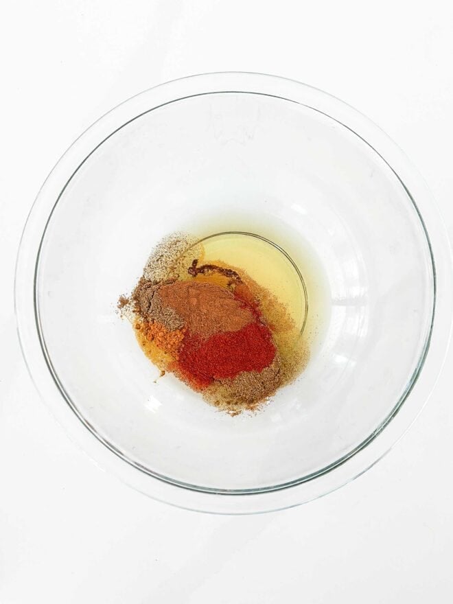 shawarma marinade ingredients in a glass bowl