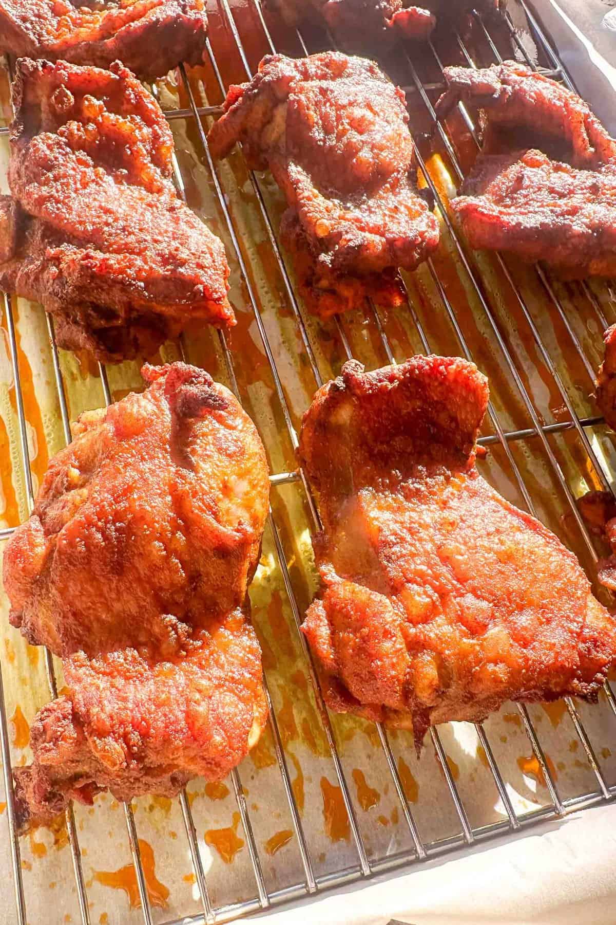 chicken shawarma thighs cooked and resting on a wire rack 