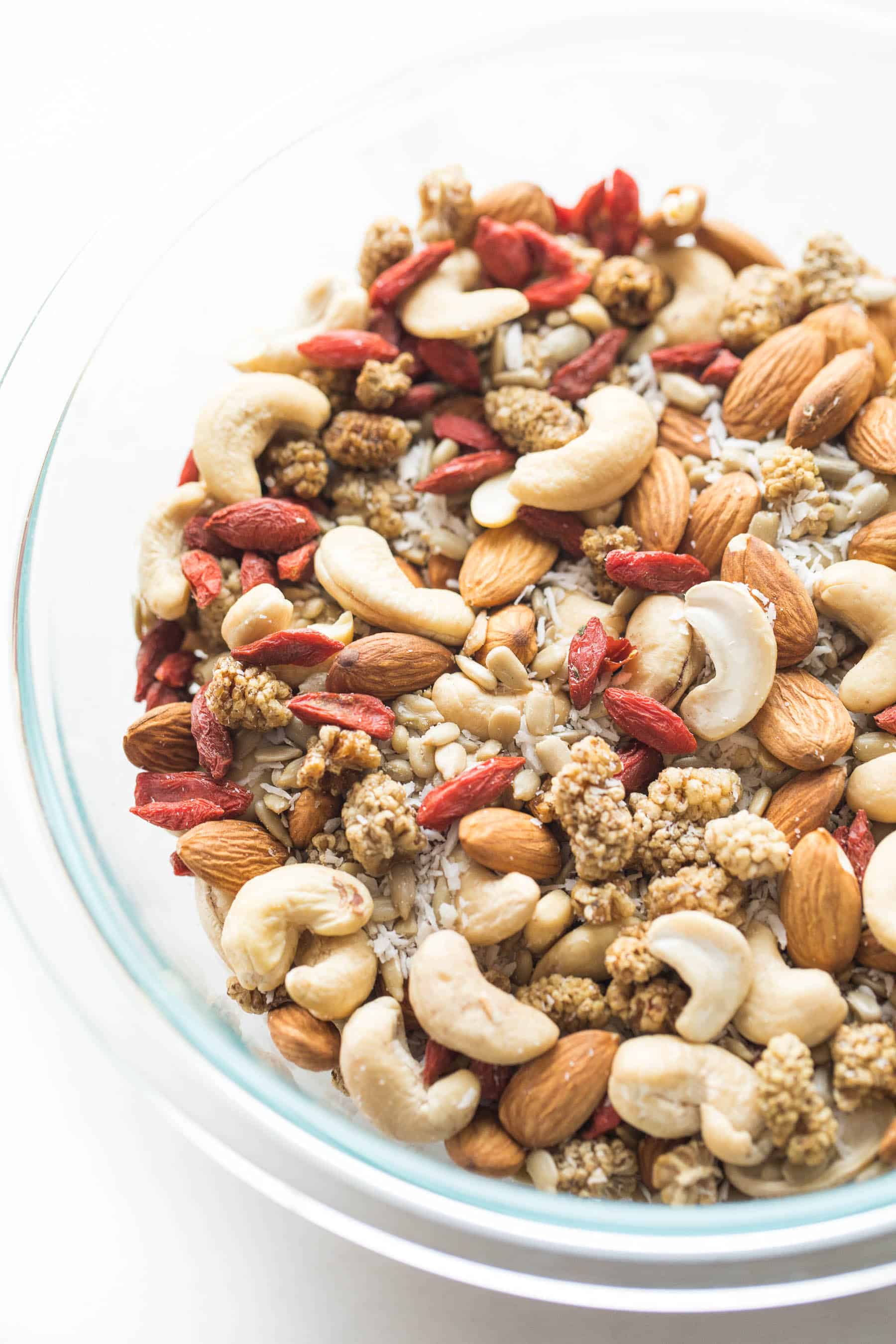 Mix of nuts and berries in a clear bowl