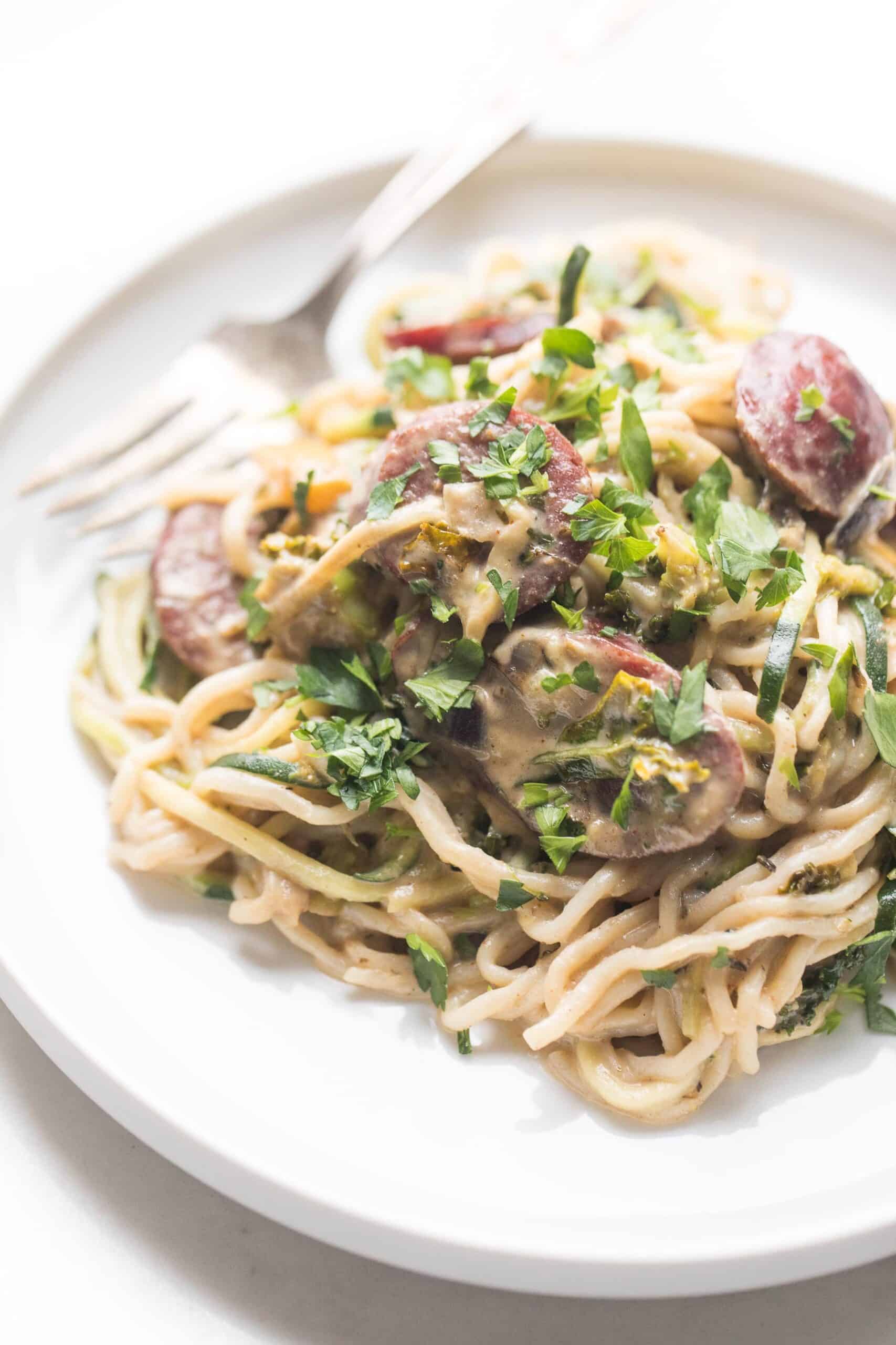 creamy pasta on a white plate and white background