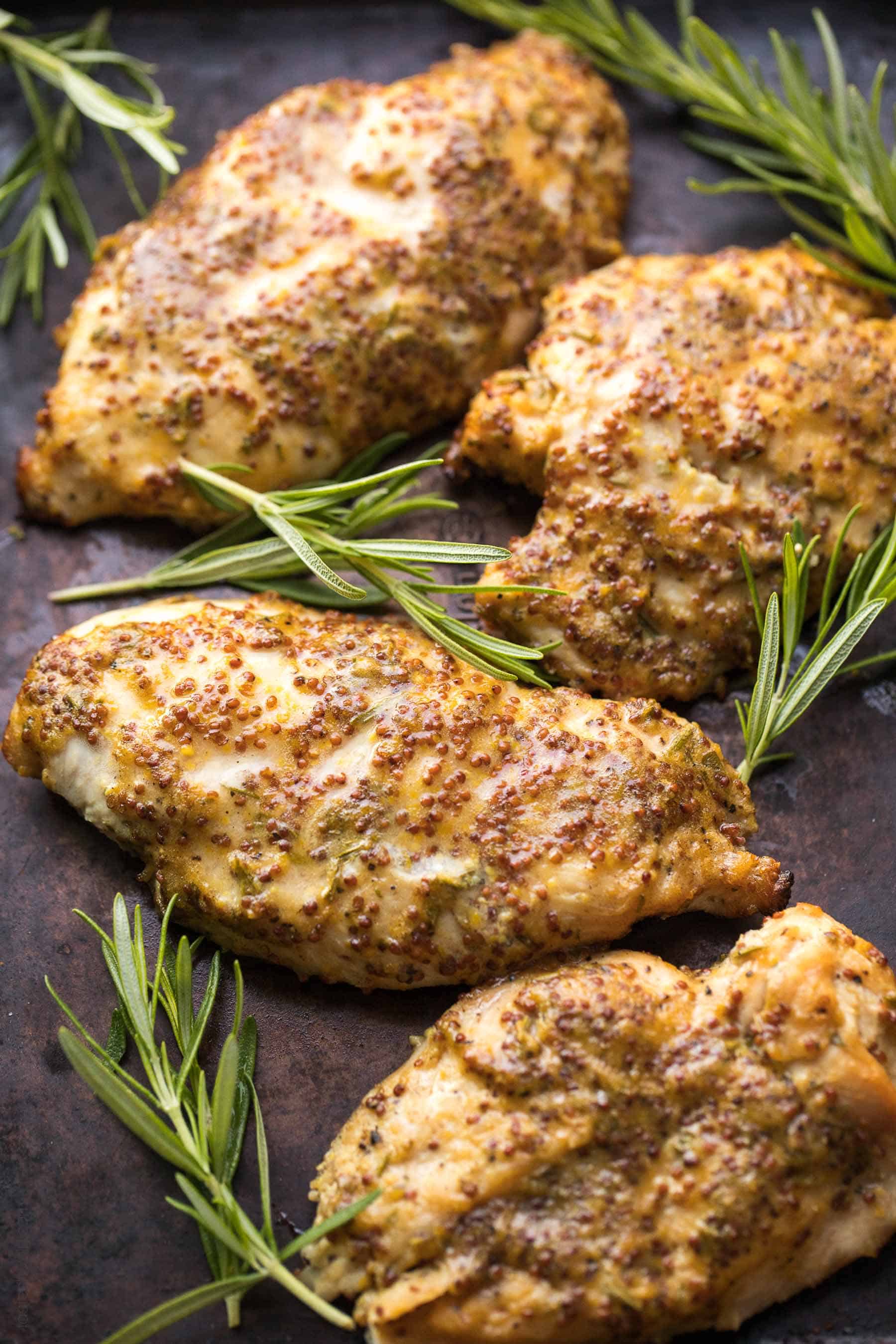 Paleo Rosemary Honey Mustard Chicken Recipe - chicken marinated in a rosemary honey mustard sauce and baked in the oven. Ready in 30 minutes! #paleo #glutenfree #grainfree #dairyfree #sugarfree #refinedsugarfree #cleaneating #realfood