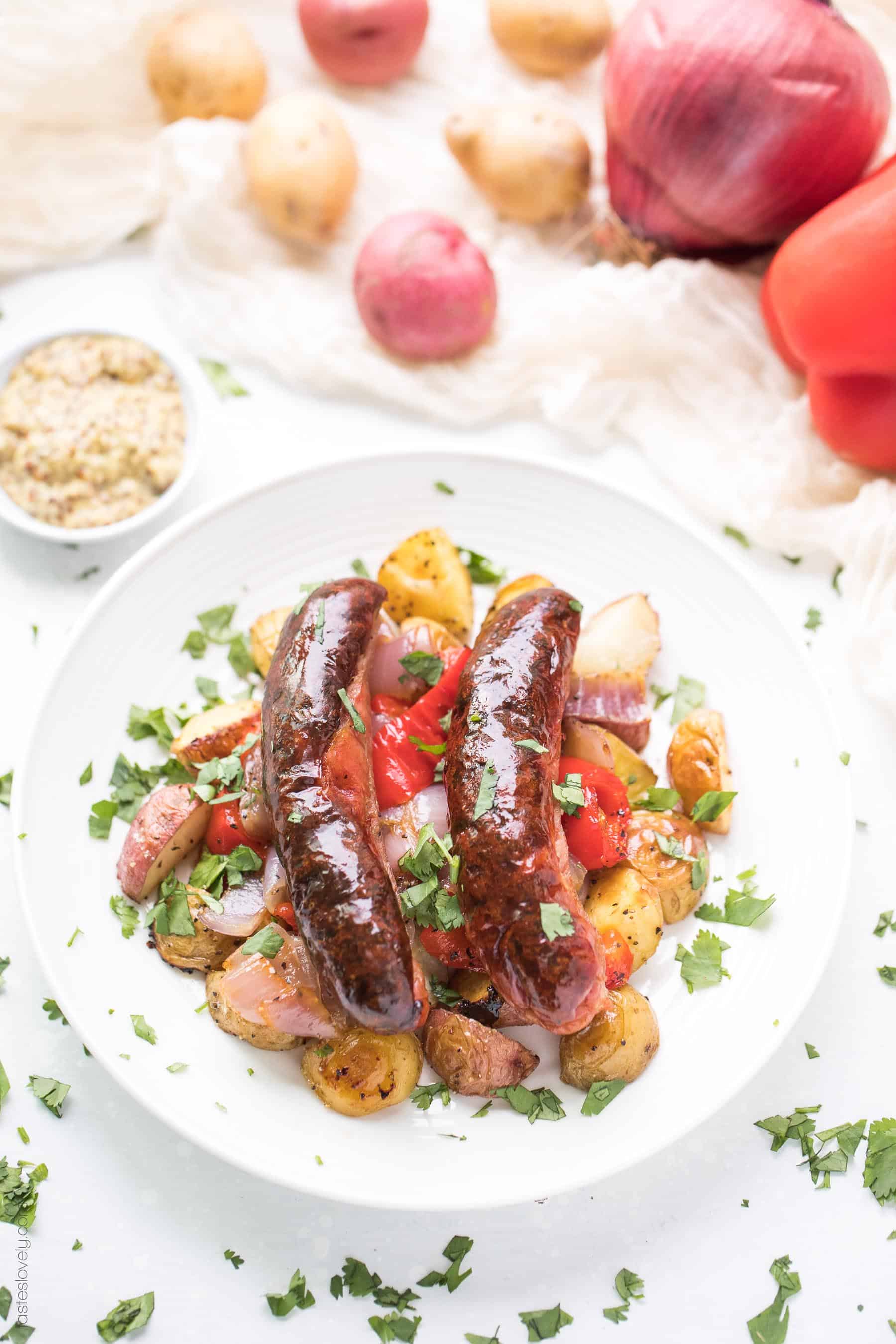 Paleo + Whole30 Sheet Pan Sausage, Bell Pepper and Potato Roast - a super quick and healthy breakfast or dinner recipe! Just 10 minutes of prep, and the oven does the rest of the work for you. #paleo #whole30 #glutenfree #grainfree #dairyfree #sugarfree #keto #cleaneating #realfood