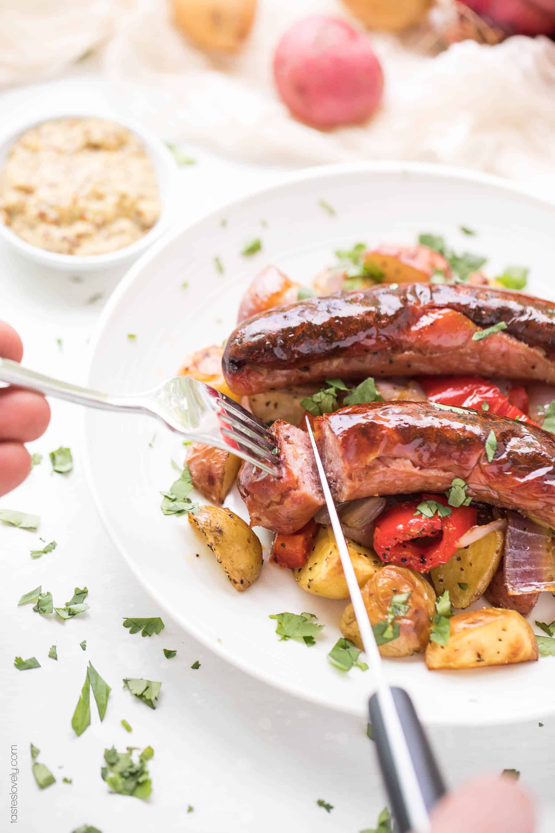 Paleo + Whole30 Sheet Pan Sausage, Bell Pepper and Potato Roast - a super quick and healthy breakfast or dinner recipe! Just 10 minutes of prep, and the oven does the rest of the work for you. #paleo #whole30 #glutenfree #grainfree #dairyfree #sugarfree #keto #cleaneating #realfood