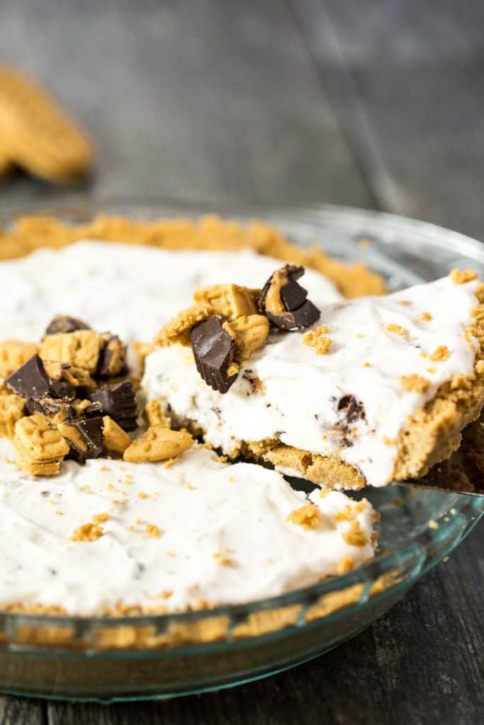 Peanut Butter Lovers Ice Cream Pie - a no bake dessert with a NUTTER BUTTER crust, vanilla and peanut butter cup ice cream filling, and a peanut butter chocolate sauce drizzled on top