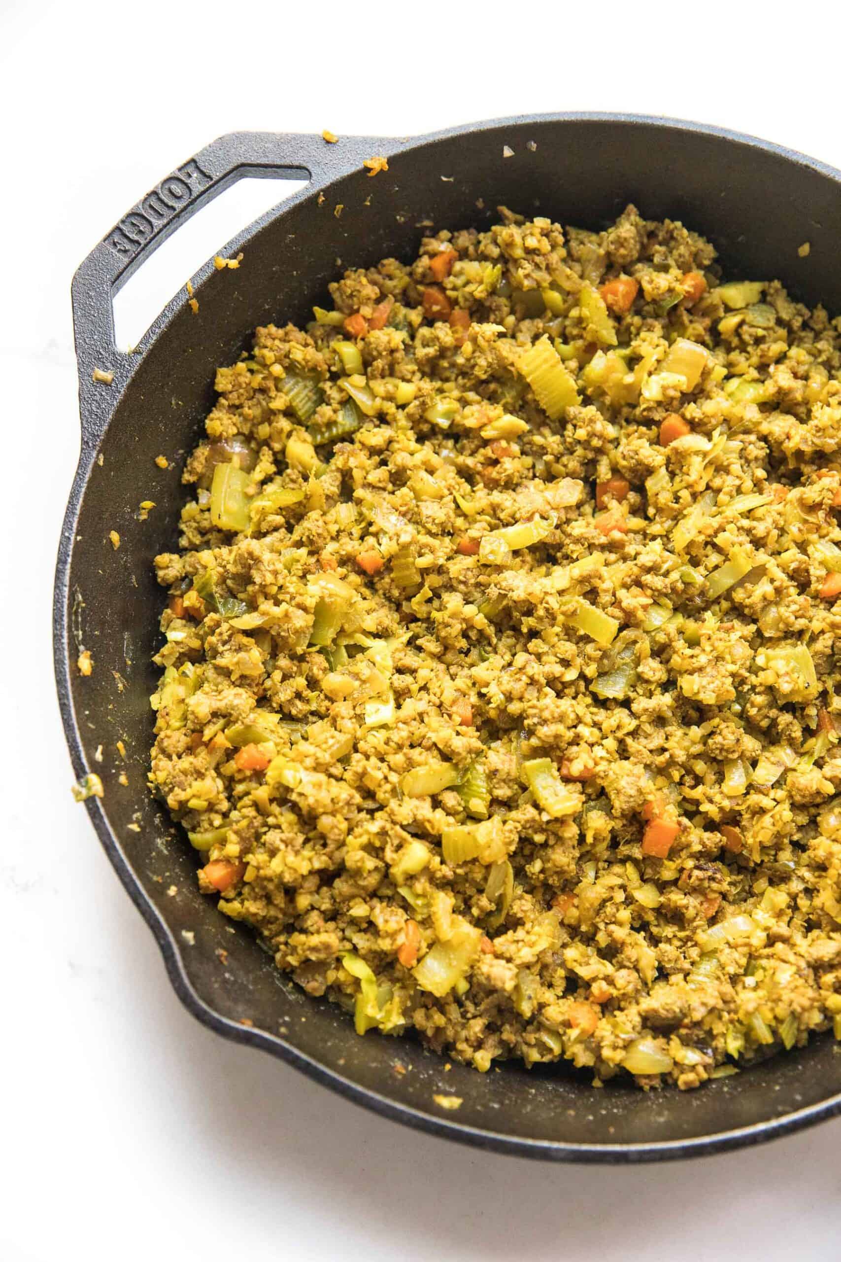 Curry lettuce wraps filling in a cast iron skillet