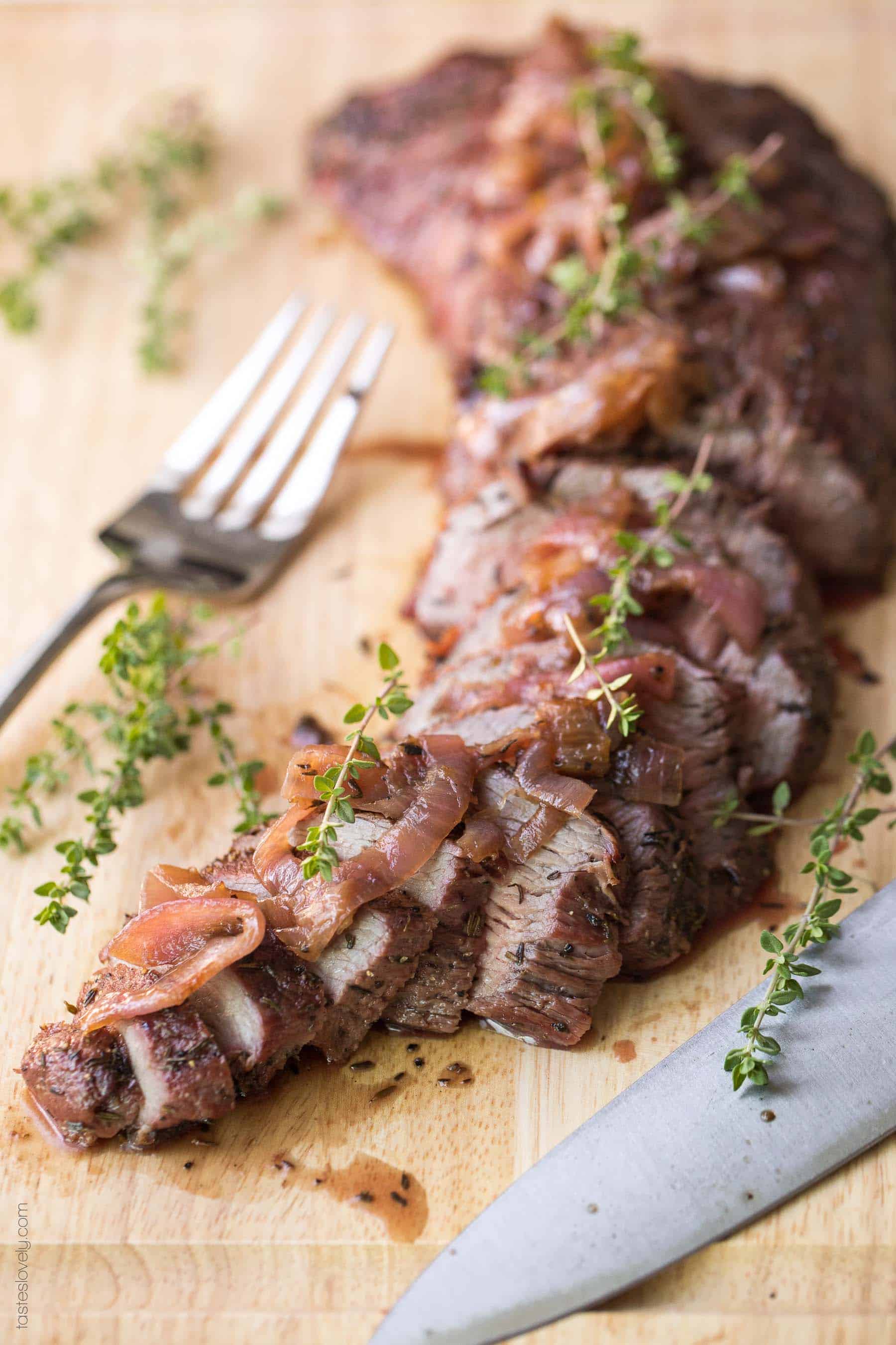 a tri tip marinated in a delicious tri tip marinated, then cooked, sliced, and topped with grilled onions