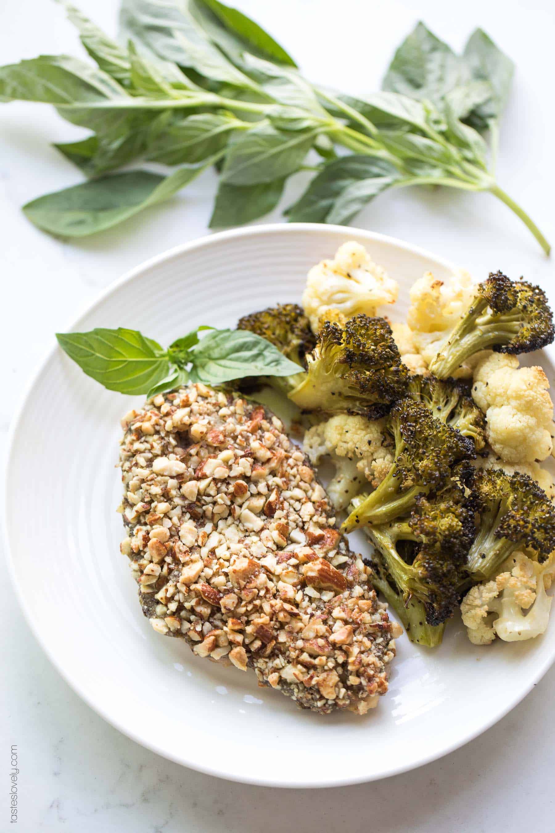 Paleo + Whole30 Almond Crusted Pesto Chicken - a quick and healthy 30 minute dinner recipe! #paleo #whole30 #glutenfree #grainfree #dairyfree #sugarfree #keto #cleaneating #realfood