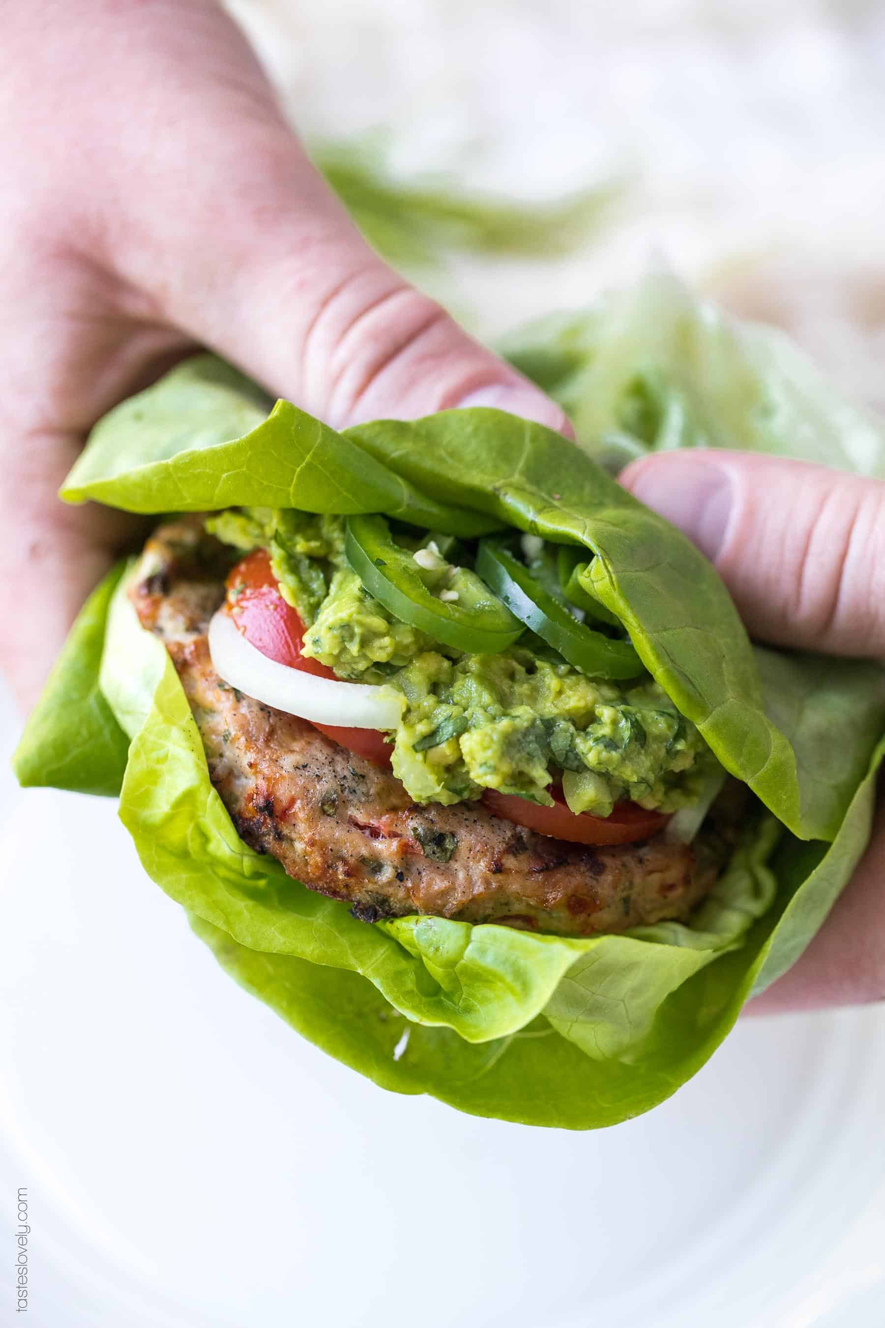 Paleo + Whole30 Mexican Turkey Burger Recipe - turkey burgers packed with Mexican flavor and topped with guacamole. A delicious and healthy 30 minute dinner! #paleo #whole30 #keto #glutenfree #grainfree #dairyfree #sugarfree #cleaneating #realfood