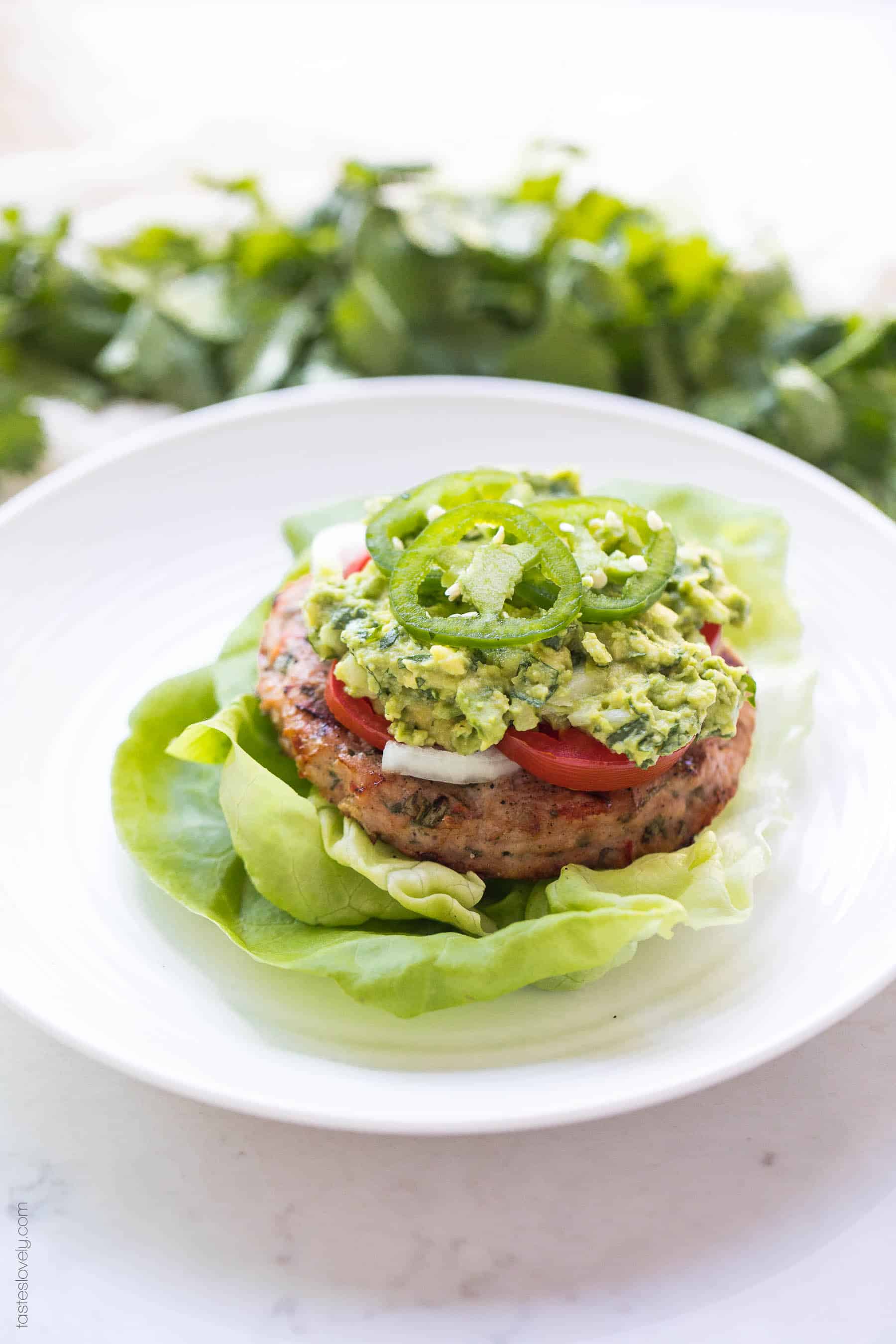 Paleo + Whole30 Mexican Turkey Burger Recipe - turkey burgers packed with Mexican flavor and topped with guacamole. A delicious and healthy 30 minute dinner! #paleo #whole30 #keto #glutenfree #grainfree #dairyfree #sugarfree #cleaneating #realfood