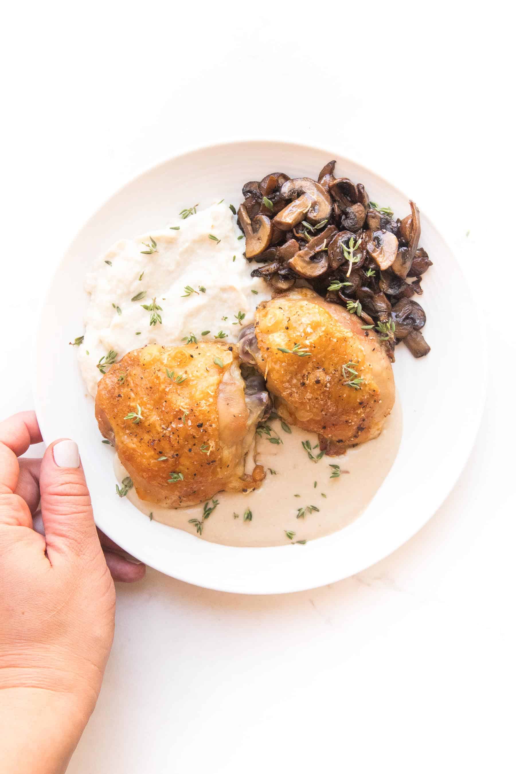 Crispy chicken thighs with mashed caulilfower + sauteed mushrooms with mustard sauce