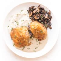 crispy chicken thighs with mashed cauliflower, sauteed mushrooms and creamy mustard sauce