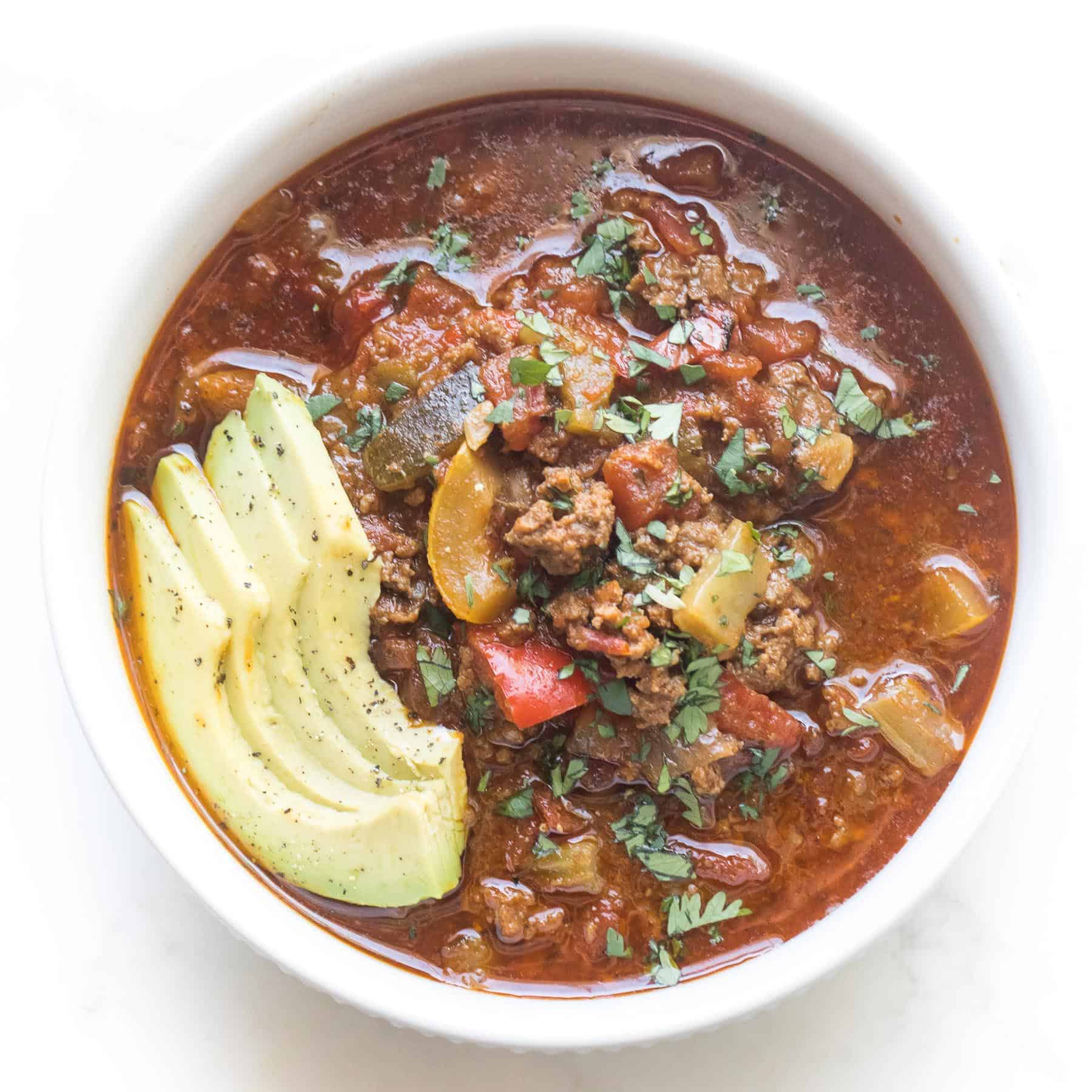 chili in white bowl and white background