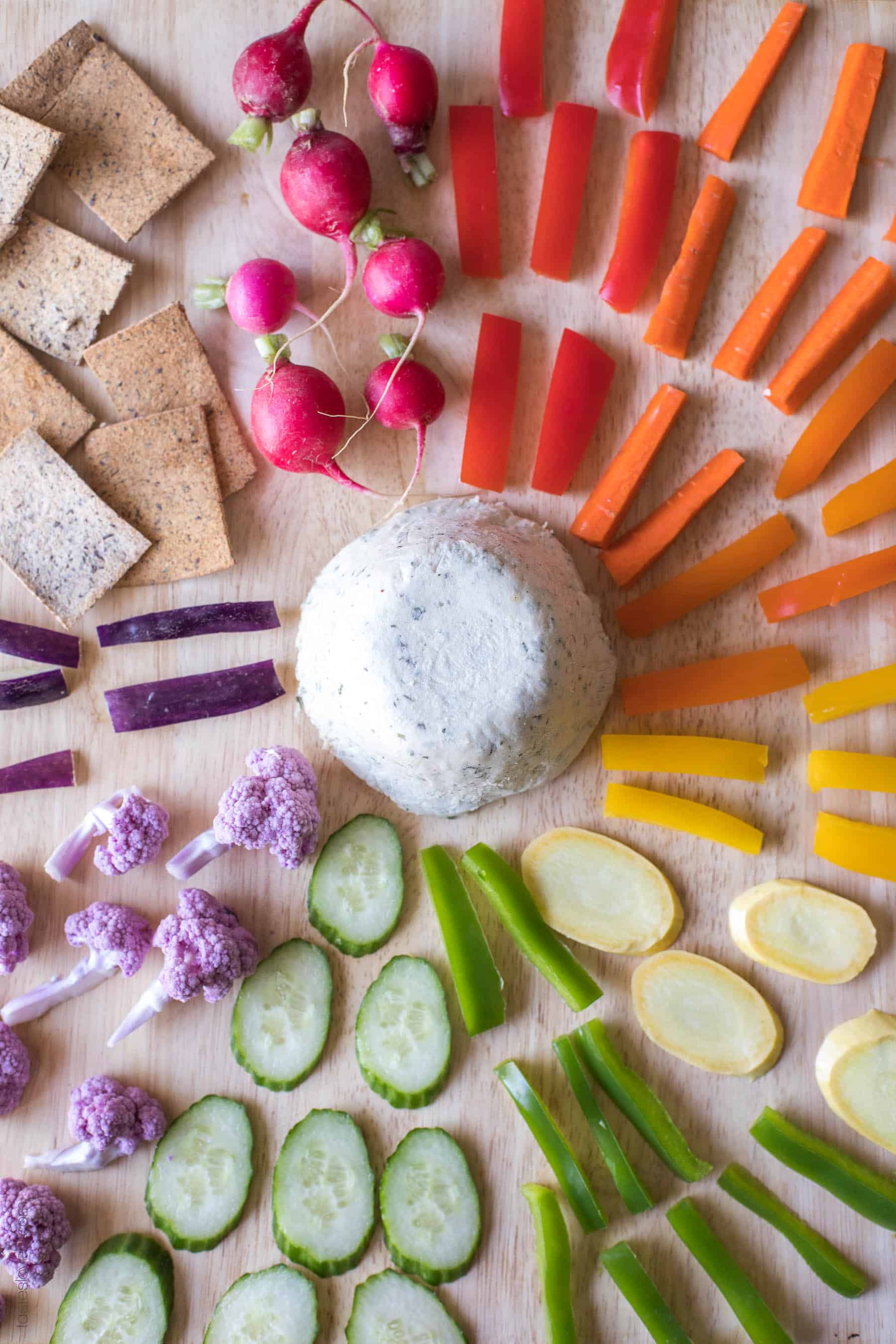 cashew cheese surrounded by rainbow vegetables