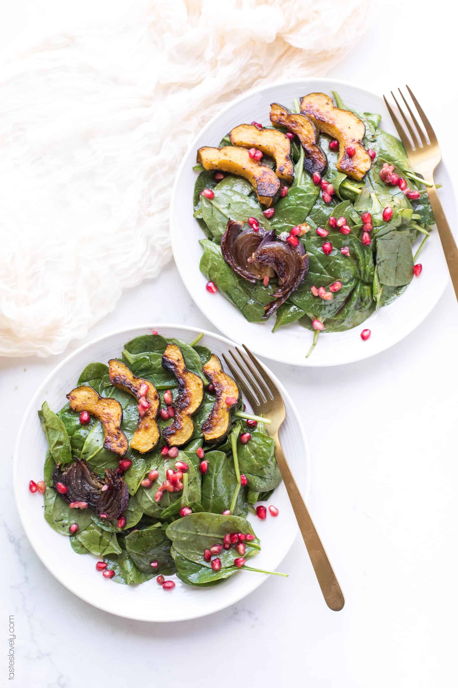 Spinach salad with roasted acorn squash, onions and pomegranates