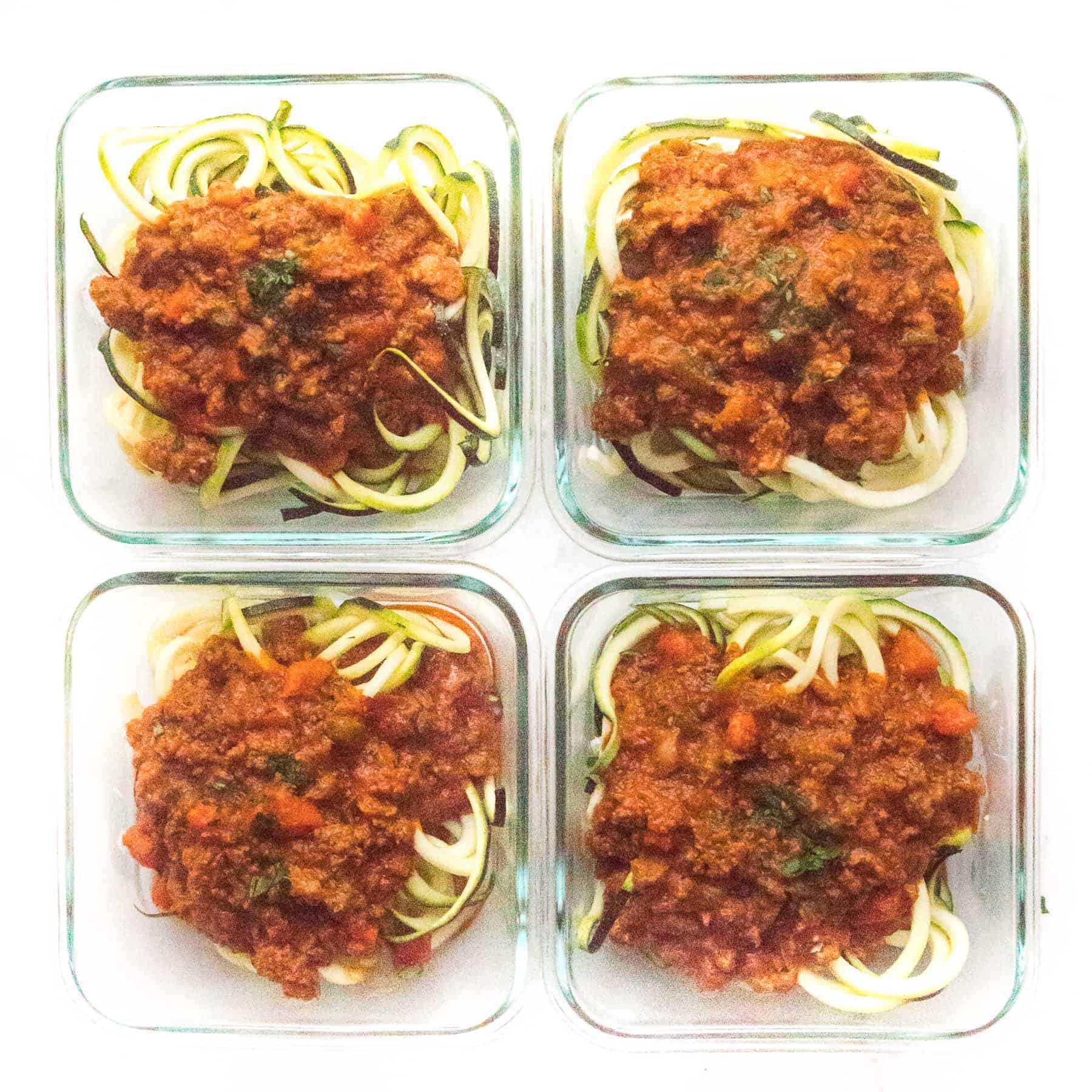 zucchini noodles with bolognese sauce in meal prep containers